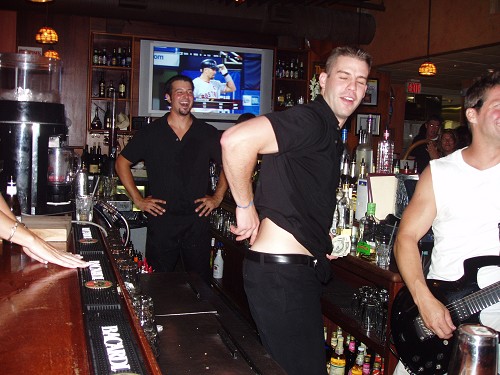 Cliff's thong is all bunched up - fixin' it for the patrons!